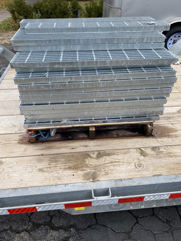 Stack of freshly galvanized new and improved steel gratin panels delivered to client. Our turnover is about 6 weeks therefore you will not wait too long for delivery. JW Investrade Inc for metalgrating.ca 2023 London Ontario