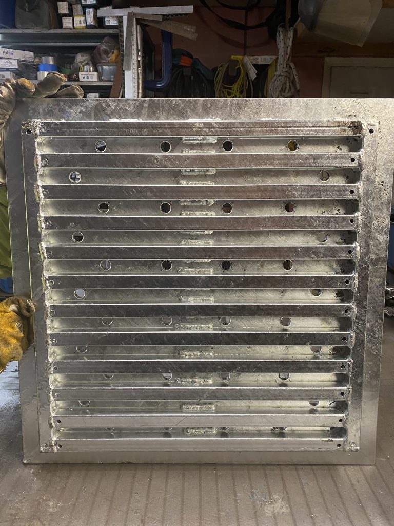 Our large floor drain cover serves as an example of compound metal grating. This floor cover consist of of heavy metal plate 3/8" thick and grating structure made from square tubing (HSTS). The heavy metal plate is welded to grating structure to form compound metal grating. All floor covers are galvanized. JW Investrade Inc. for metalgrating.ca 2023, London, Ontario