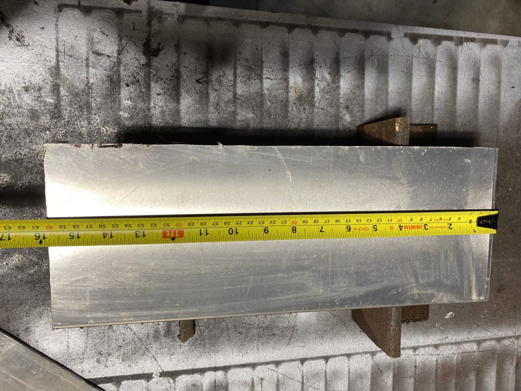 The skill for accurate measurement is paramount in any project. The image shows the simple setup for tape measure to provide an accurate reading but the bow of the tape does not allow to read the measurement precisely. The read measurements are about 15 3/4 inch or 40cm
