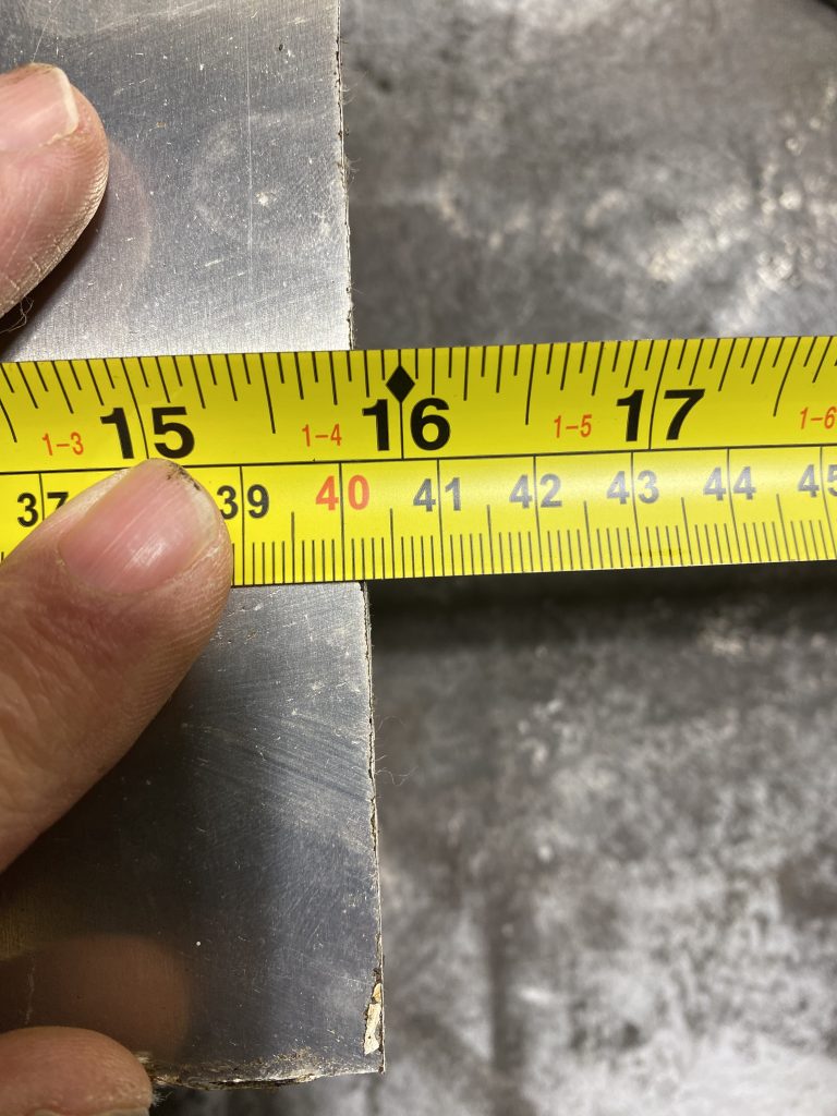 By pressing down on the edge of measuring tape on metric side I have closed the distance between the edge of tape and the surface of material for grater measurement accuracy. With a finger I have pressed down on the edge of the tape measure on the metric side the reading passes the 40cm mark by 2 mm. JW Investrade Inc for metalgrating.ca 2023 London, Ontario