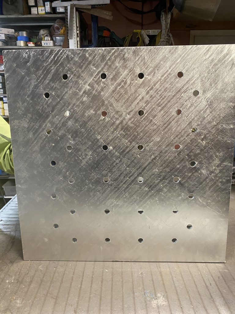 Top view of large floor drain cover 26 inch x 26" square. This large floor drain cover replaced collapsed old drain cover. The whole structure is galvanized. This drain cover will sustain a load of heavy steel structure in the shop. JW Investrade Inc. for metalgrating.ca 2023, London, Ontario