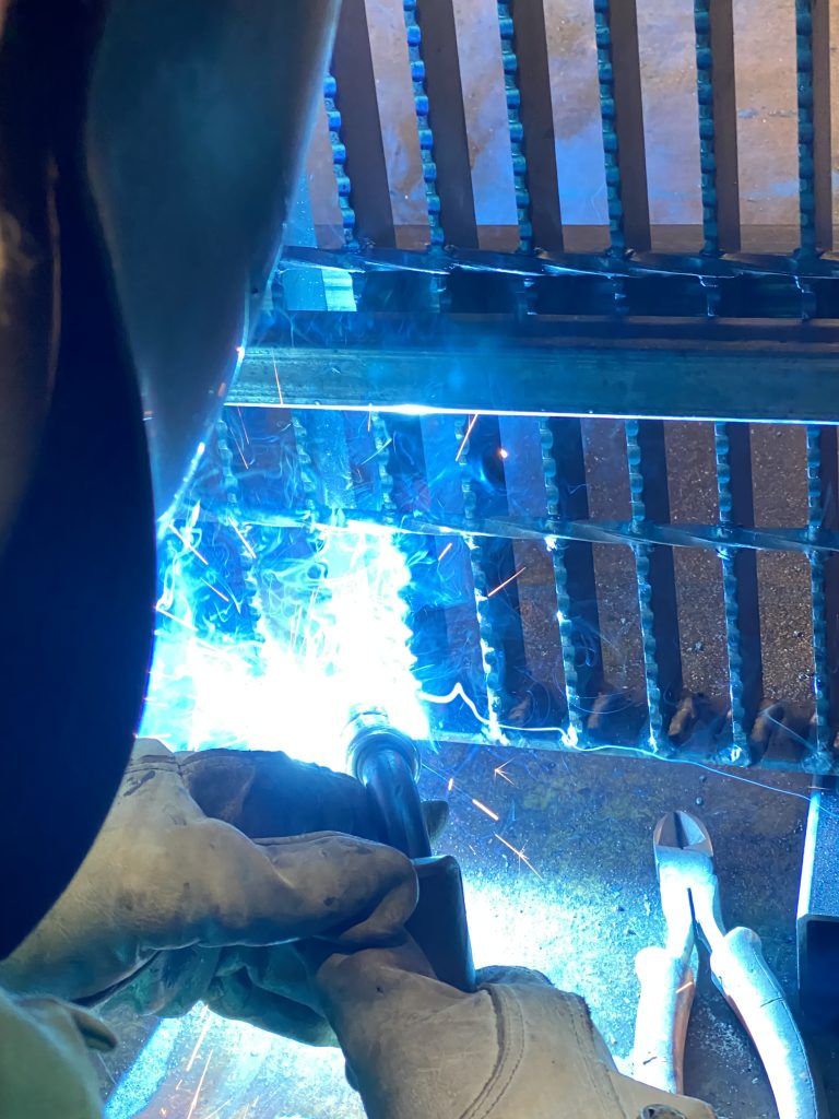 We weld bearing bars to the banding bar in grated steel with 2 antivibration welds. These welds always cover the whole depth of bearing bar disregarding its size. They also penetrate the front face of these bars. Our welding standards exceed NAAMM recommendations. JW Investrade Inc. for metalgrating.ca 2023 London Ontario