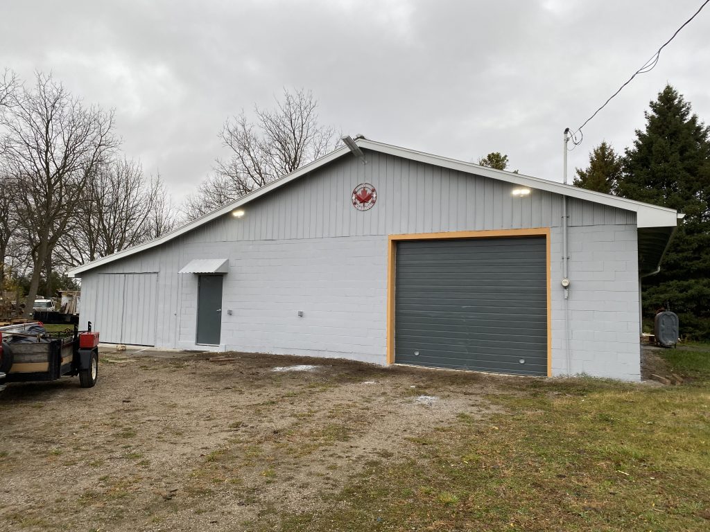 The shop is fully renovated and freshly painted with security lights and cameras. The large front yard allows for material storage outside of the shop.