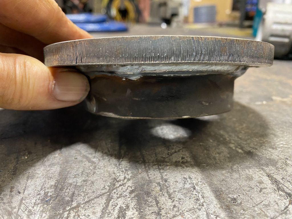 Closeup of circular cover prior galvanization with clearly visible drain channel and its weld. For JW Investrade Inc. www.metalgrating.ca, London, Ontario, 2024