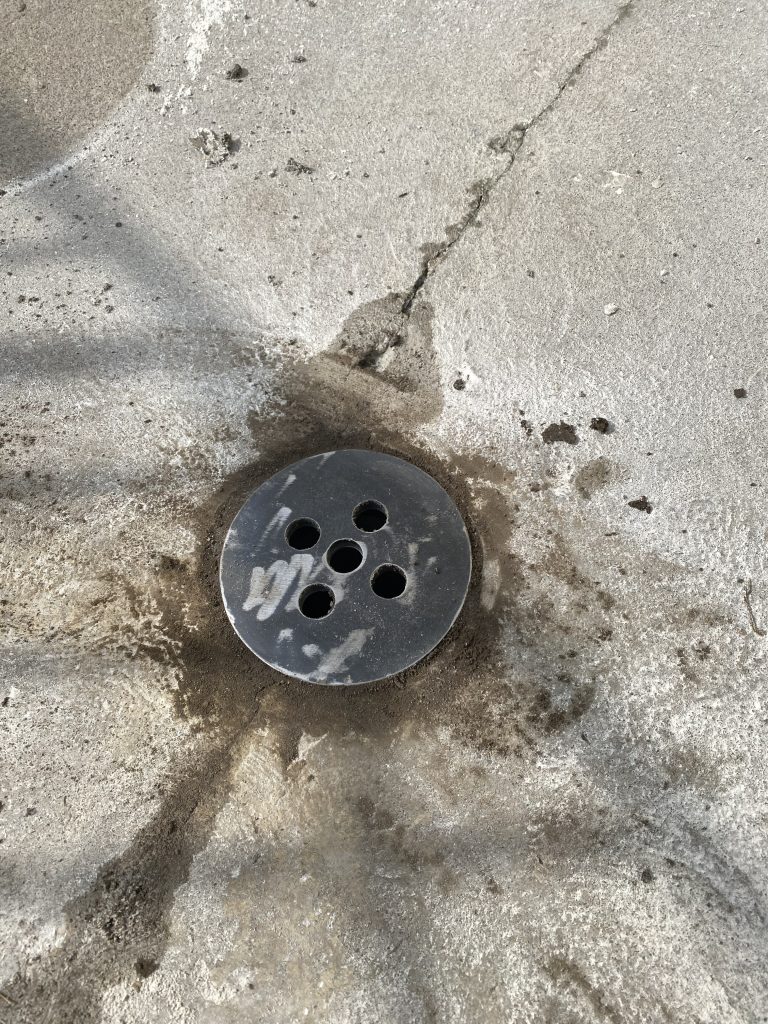 Tryout of flush installation for circular drain cover prior its galvanization. Small circular drain covers are mush harder to install flush to concrete. For JW Investrade Inc. www.metalgrating.ca, London, Ontario, 2024