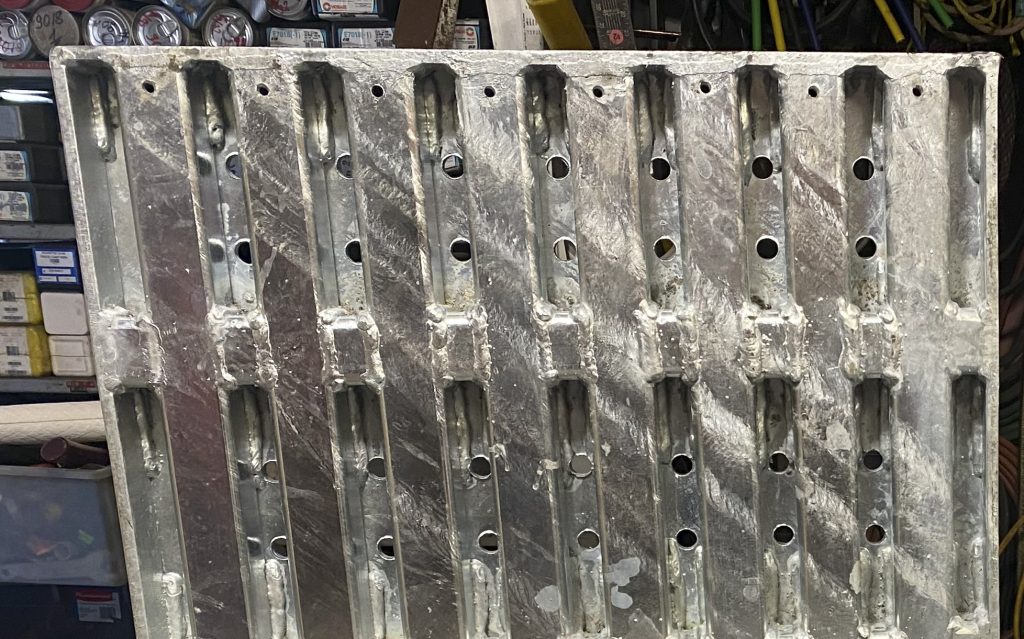 Supported style of cover in depth of 2 1/2" for heavy semitrucks vehicular traffic with low dynamic loads. This cover will carry static load of semitruck's half axle. For JW Investrade Inc. www.metalgrating.ca, London, Ontario, 2024